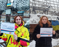 Women stand with #WhatMakesMeStronger placards