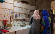 Ferhana in her shop after successfully persuading the de facto government to let her business remain open.