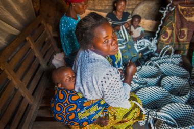 Women in the Democratic Republic of Congo weave baskets to sell at their local market 