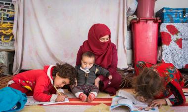 Women and children writing