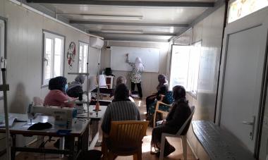 Women in a training facility at the Basirma refugee camp