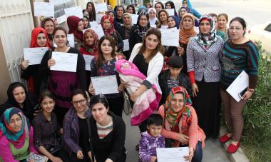 many women holding up papers