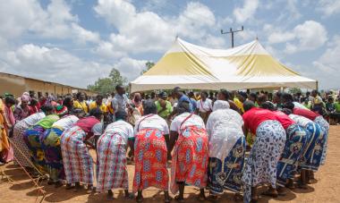 people gathered bending over