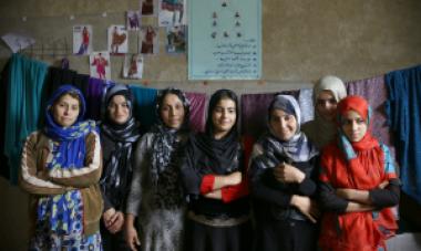 group of women in headscarves looking at camera 