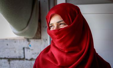 woman with red headscarf