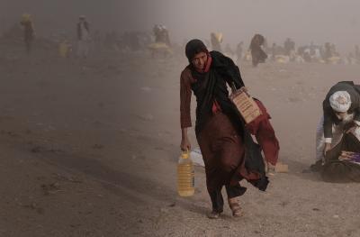 Afghan woman in dust storm in Herat